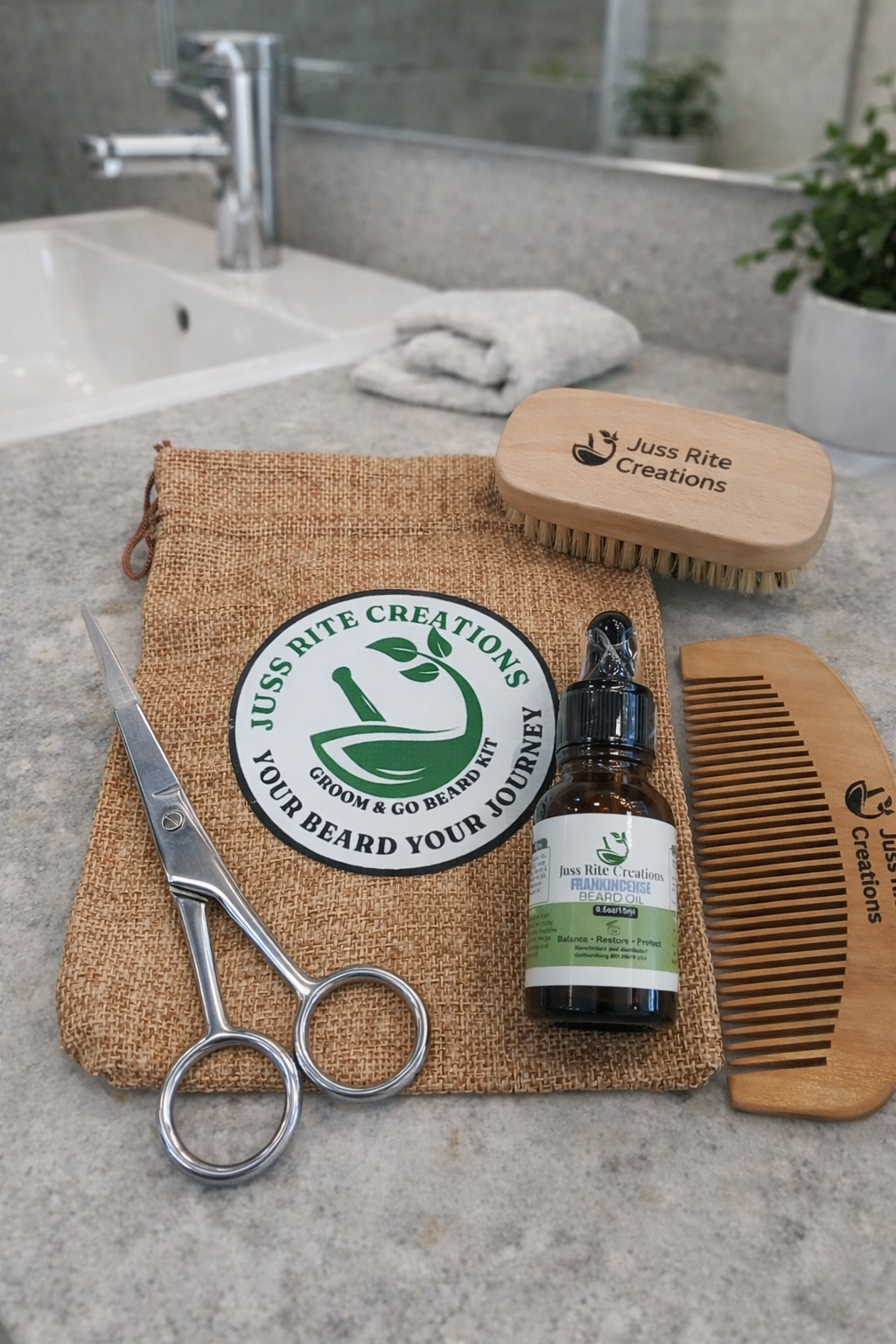 Grooming kit with brush, comb, scissors, and bottle on a textured surface with 'Juss Bite Creations' branding.