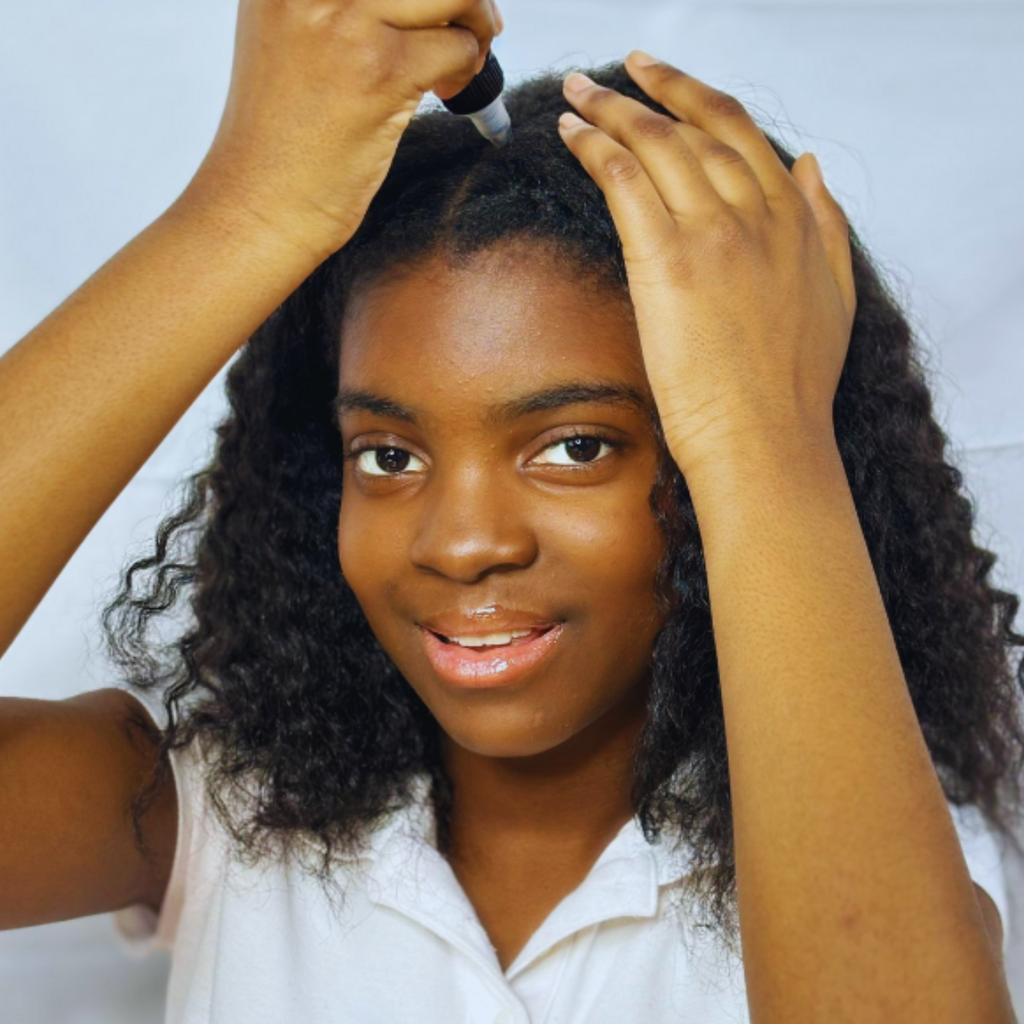 Woman styling her hair with a white background