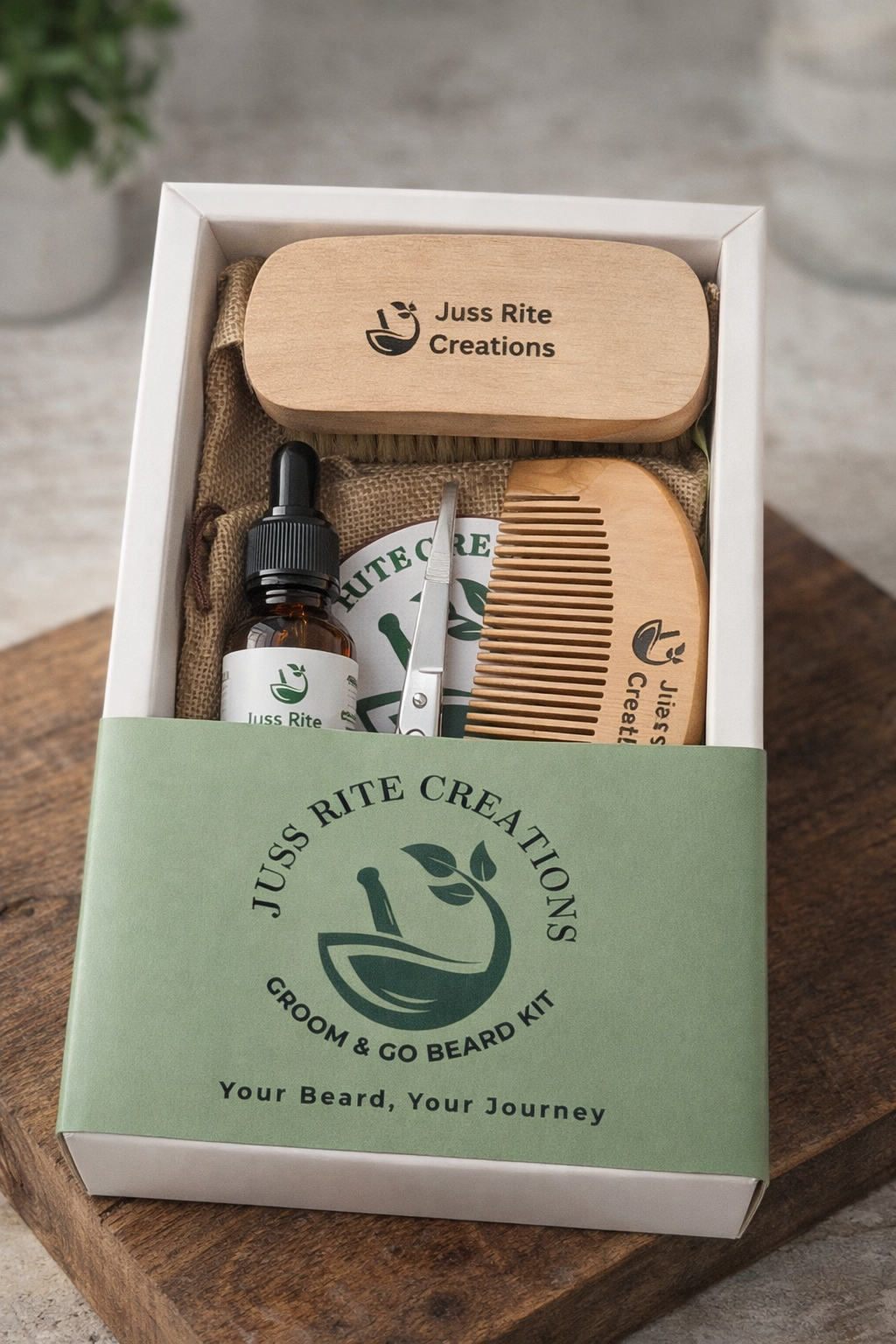 Juss Rite Creations beard grooming kit with a wooden comb, brush, and bottle on a wooden surface.