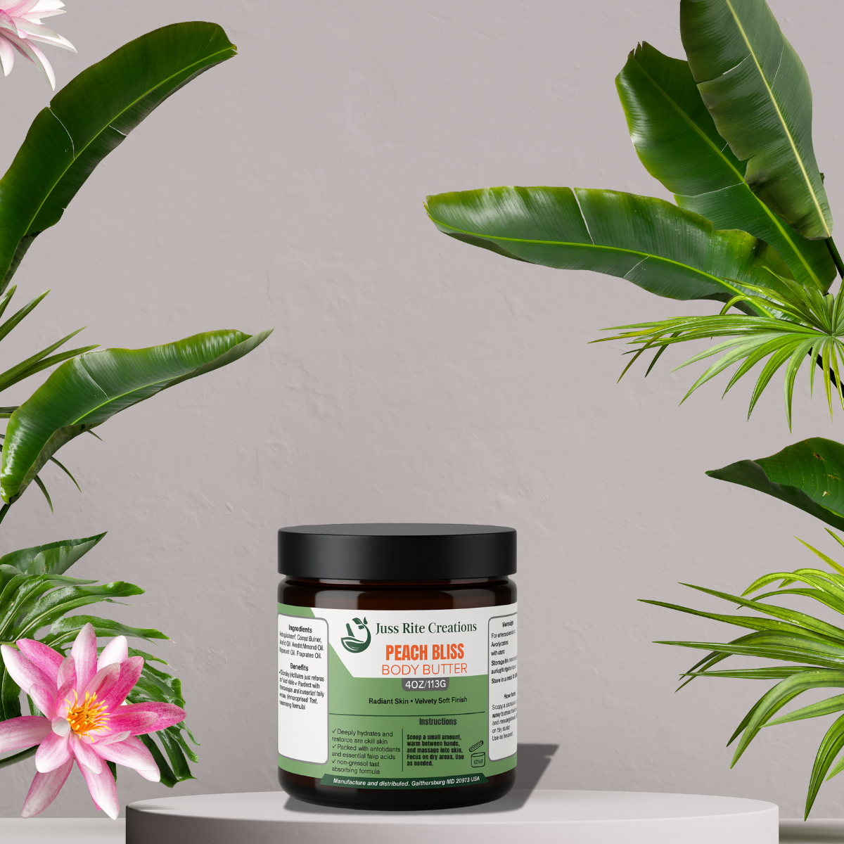 Jar of Peach Bliss body butter with green label and black lid, surrounded by tropical plants and flowers.