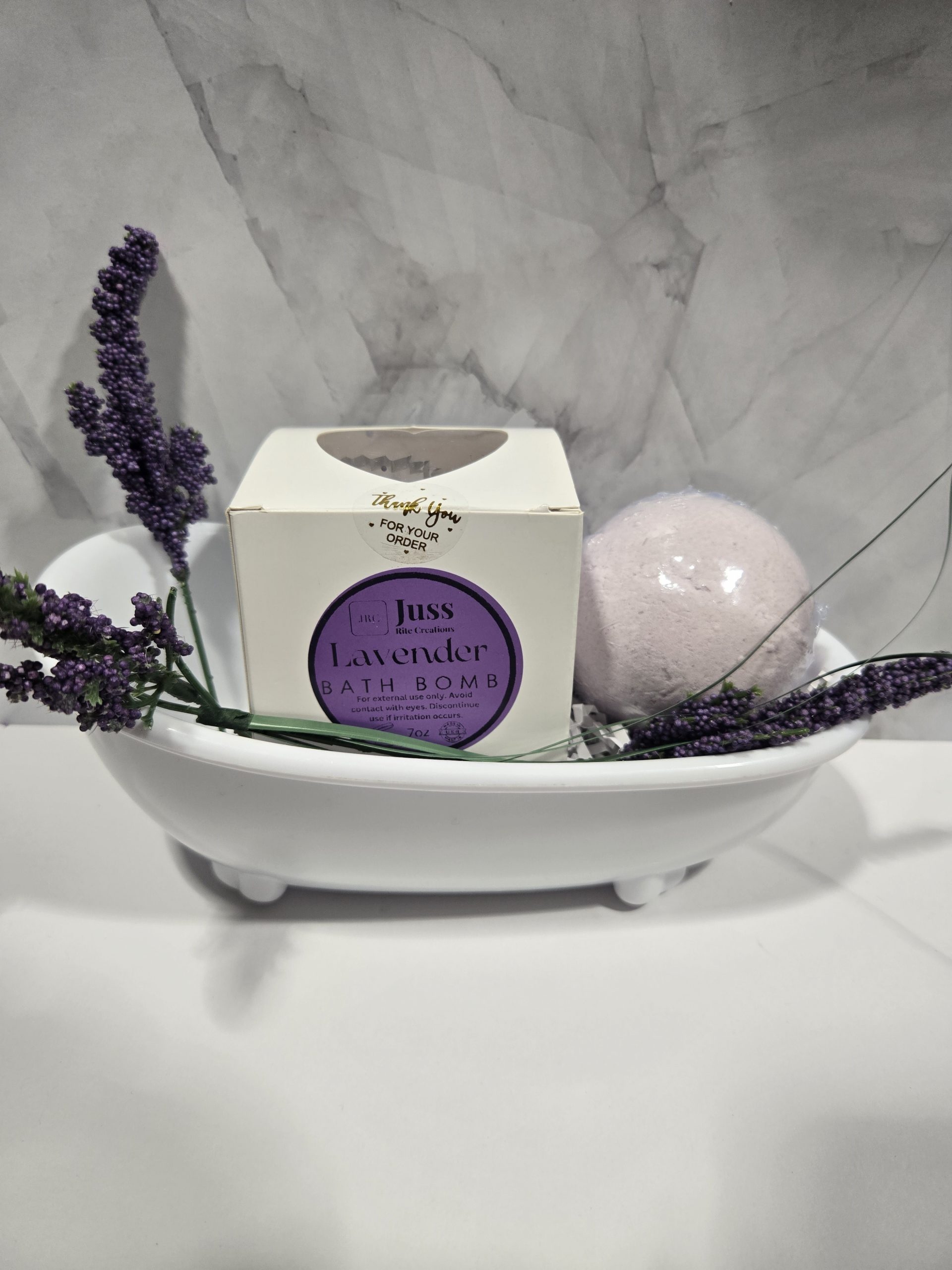 Bath bombs displayed in a bathtub dish.