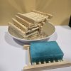 Bamboo Wood Soap Holder stacked together and one displaying a soap.