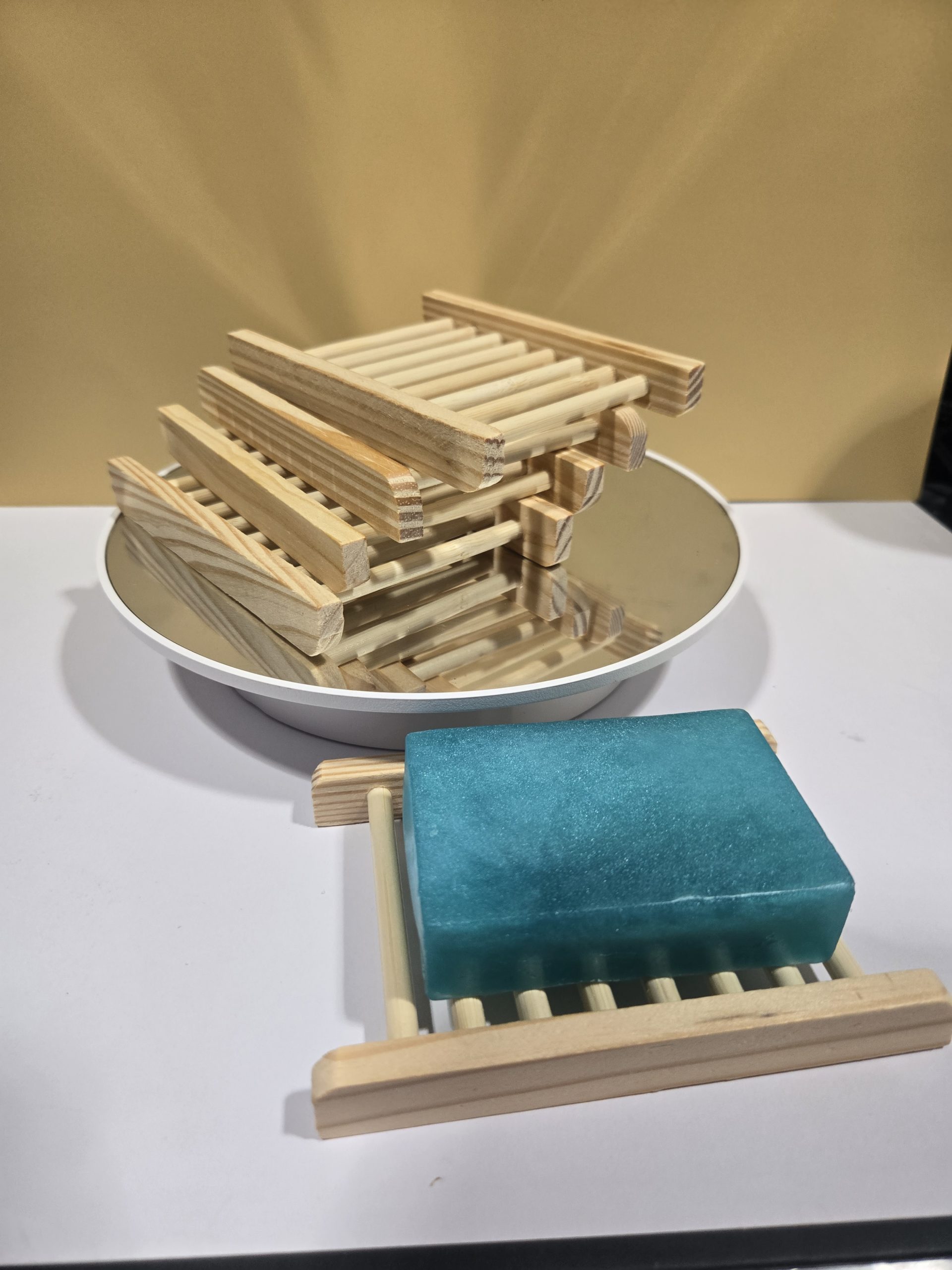 Bamboo Wood Soap Holder stacked together and one displaying a soap.